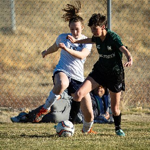 JV Girls Soccer player chases the ball